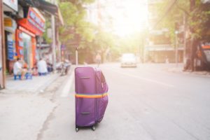 Purple Luggage with rainbow luggage straps