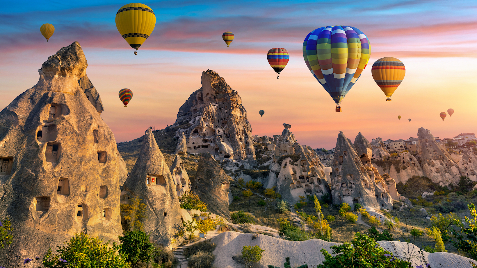 hot air balloons fly over Cappadocia, Turkey