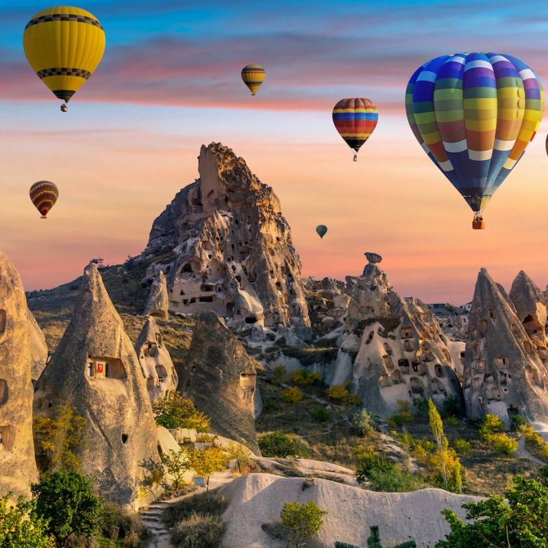 hot air balloons fly over Cappadocia, Turkey