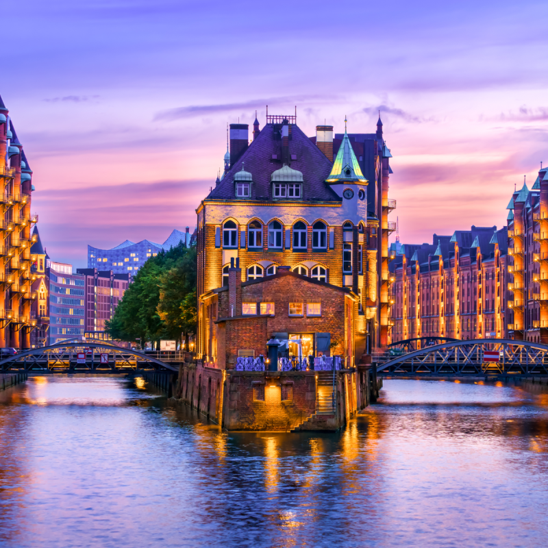 The Warehouse District (Speicherstadt) in Hamburg, Germany, at dusk.