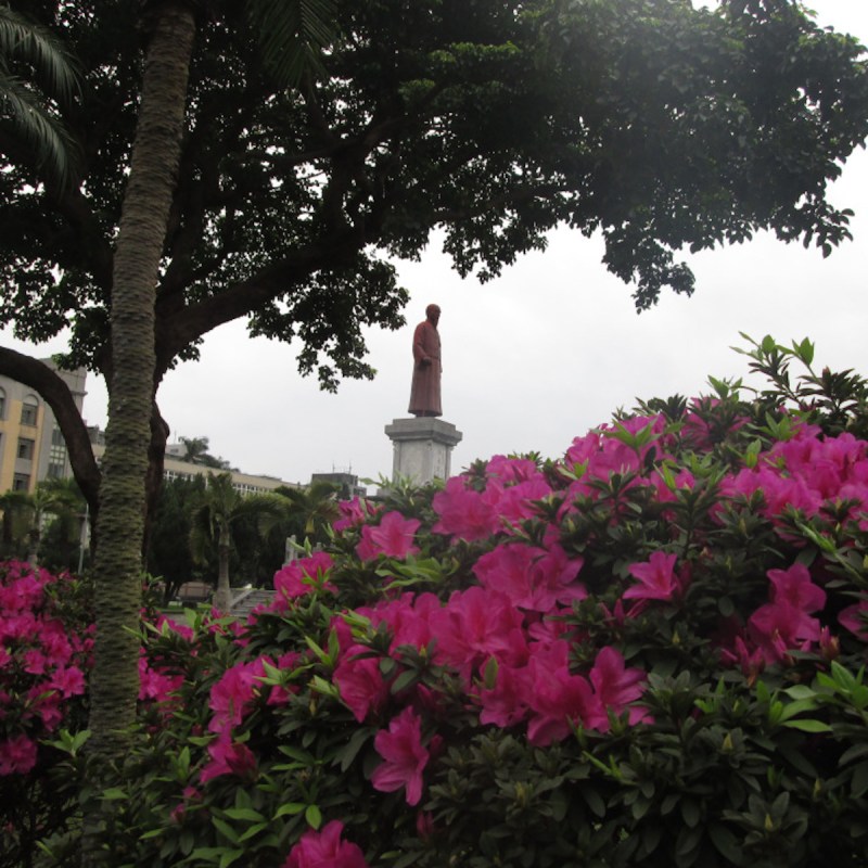 Taipei street scene with statue.