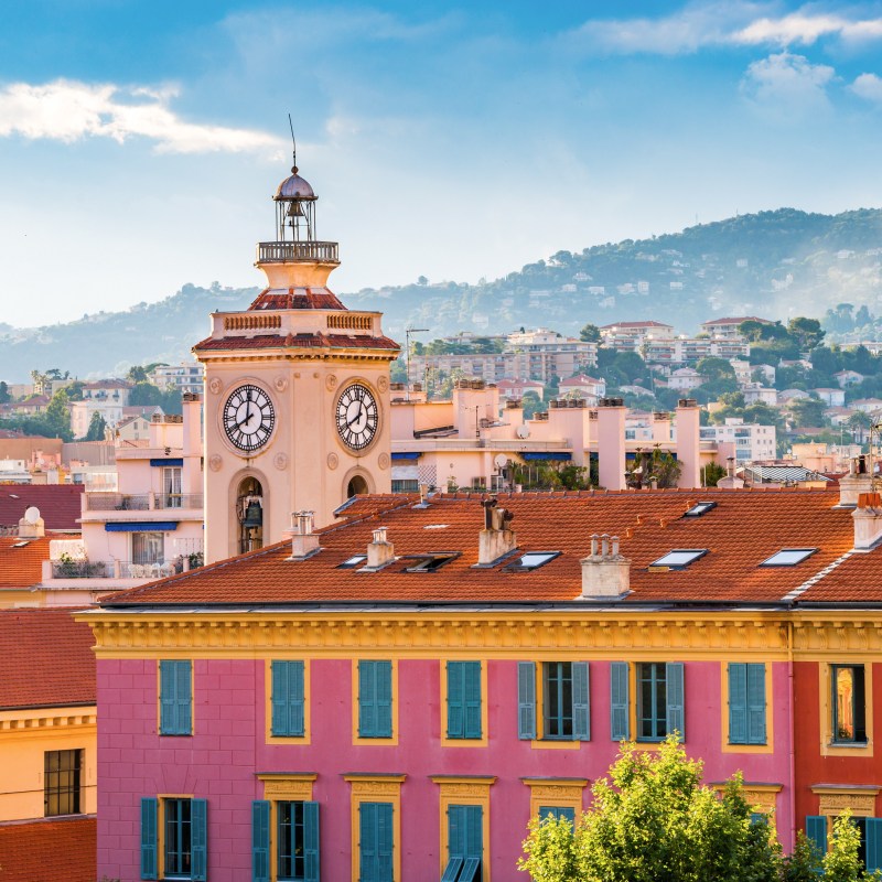 A clock tower over the Old Town of Nice, France.