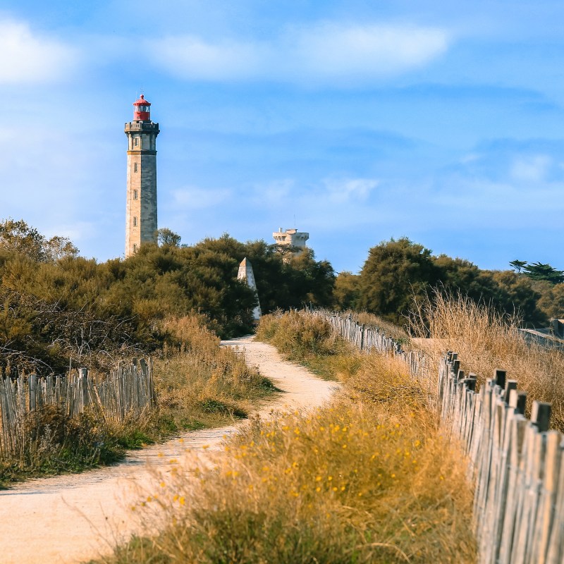 A lighthouse on the beach on Ile De Re, France.