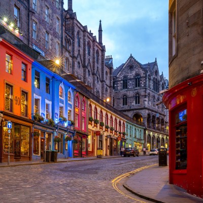 A street full of restaurants and shops in Edinburgh.