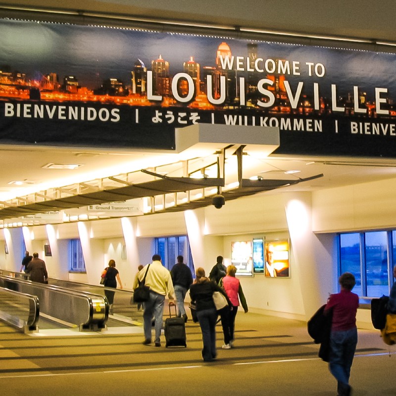 A "welcome to Louisville" sign in the airport.