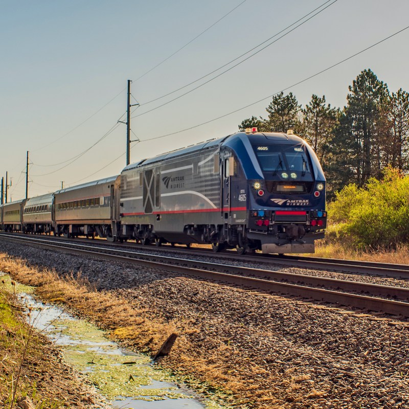 An Amtrak train on a track.