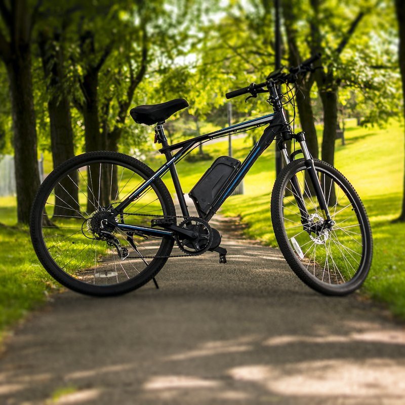 An electric bike in a park.