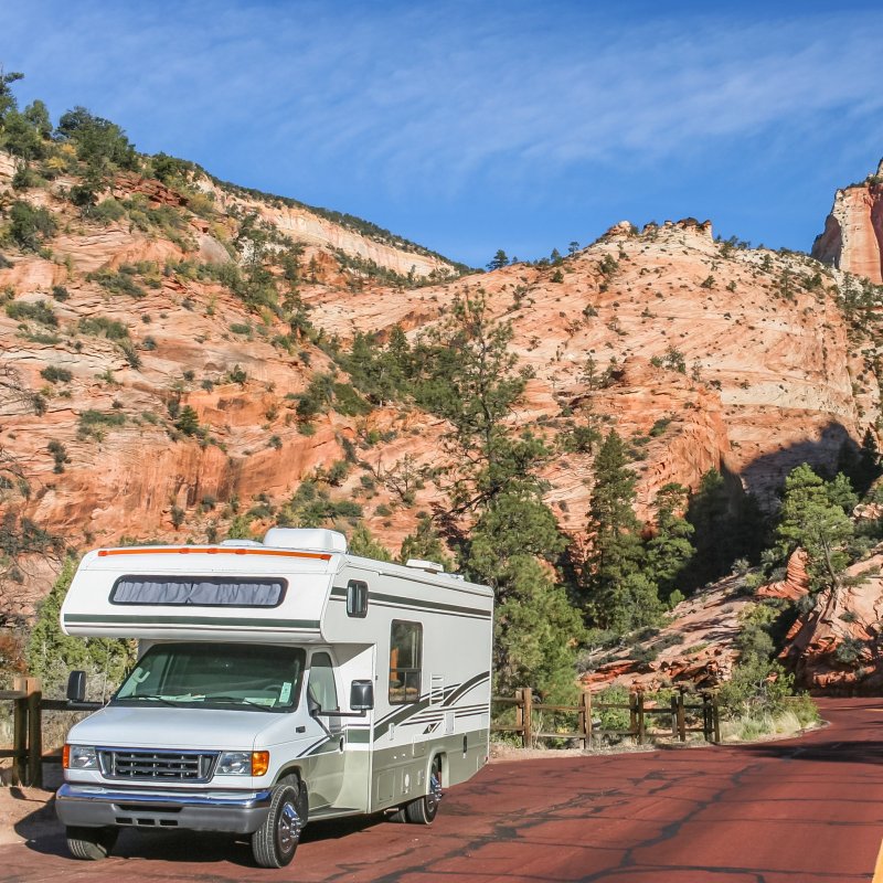 An RV driving through Zion National Park in Utah.