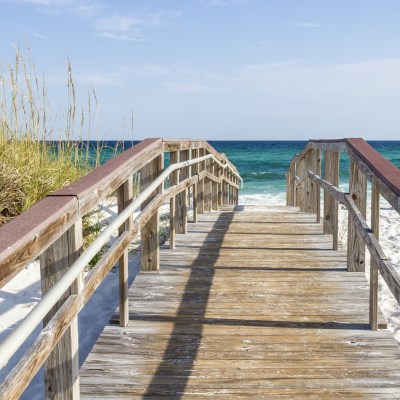 Boardwalk leading to the sea on Pensacola Beach in Florida.