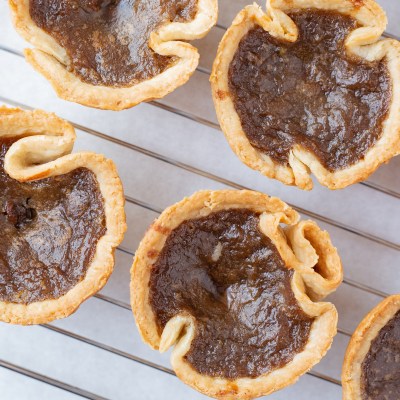 Butter tarts on a rack.