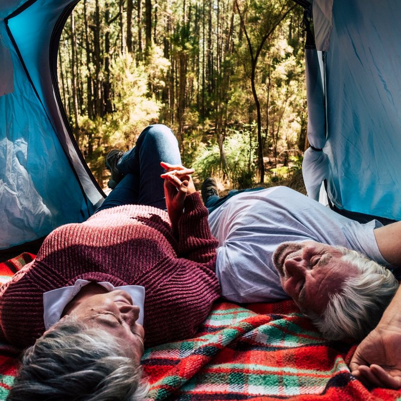 Couple free camping in the wild.