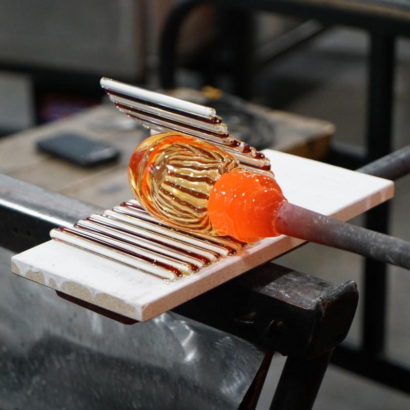 Creating a glass pumpkin at the Corning Museum of Glass.