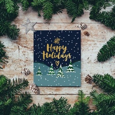 Happy Holidays card surrounds by Christmas garland
