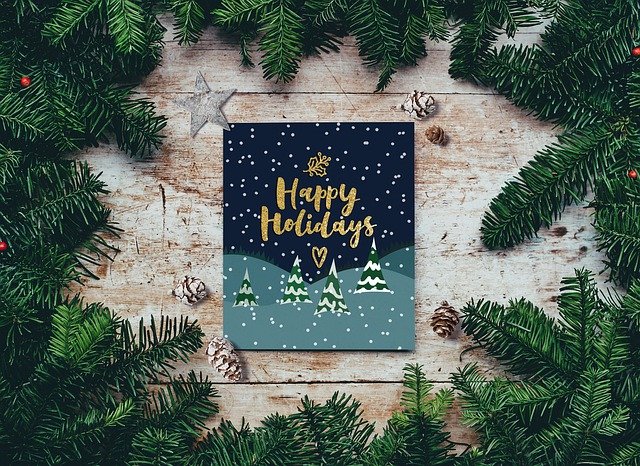 Happy Holidays card surrounds by Christmas garland