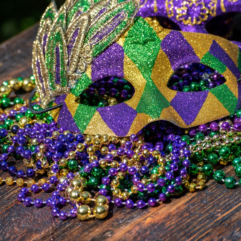 Mardi Gras mask and beads.