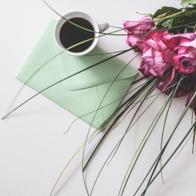 Mother's Day cup of coffee, card, and flowers
