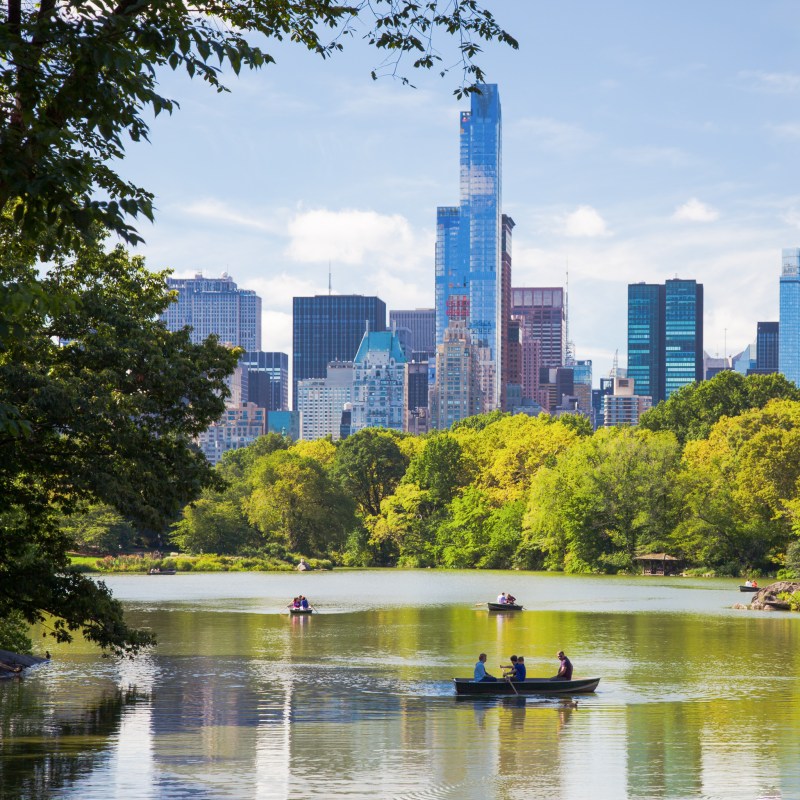 People enjoying the lake in New York City's Central Park.