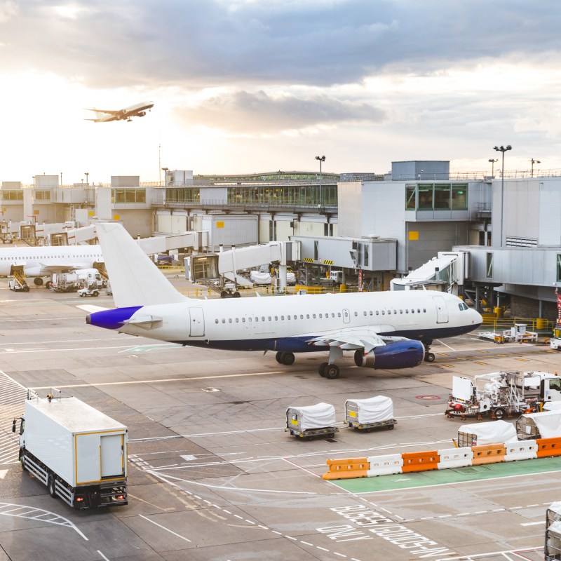 Planes arriving and departing from a busy airport.