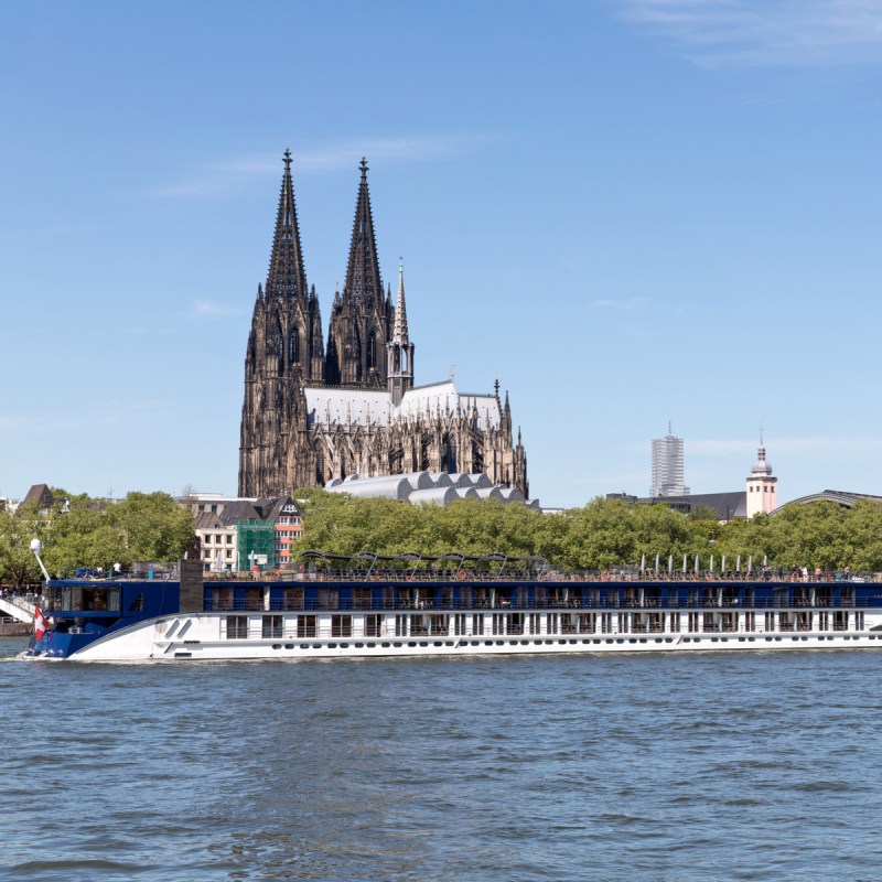 River cruise ship AMASTELLA passing Cologne Cathedral.