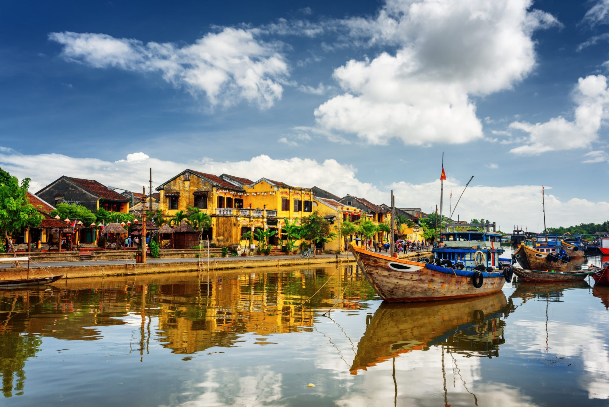 wooden boats in front of Hoi An in Vietnam