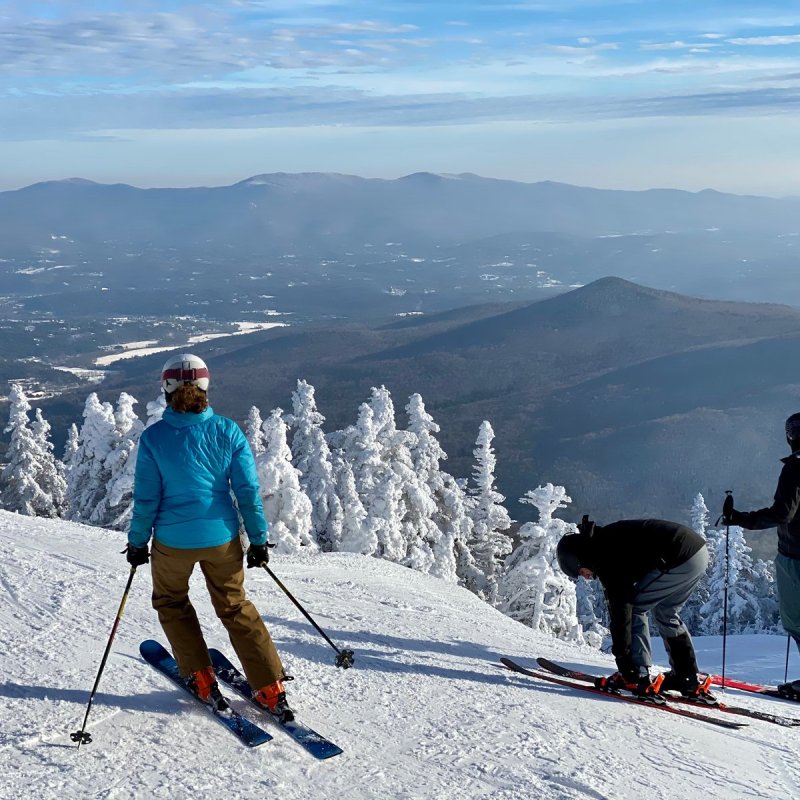 Skiers ar Stowe Mountain Ski resort Vermont.