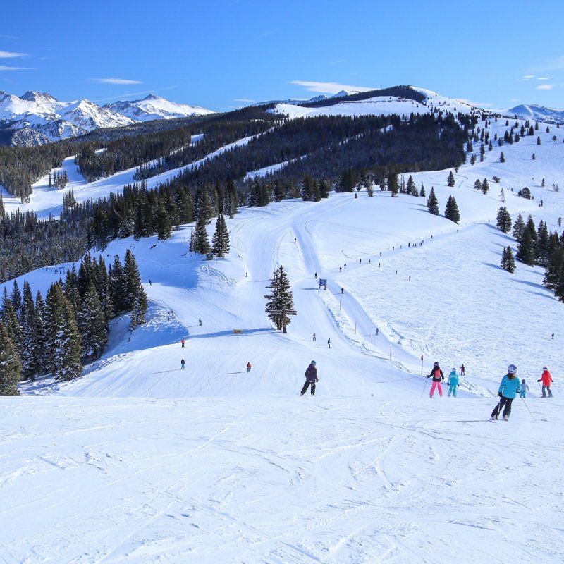 Skiers enjoying the slopes in Vail, Colorado.