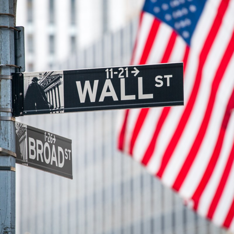 The American flag on Wall Street in New York City.