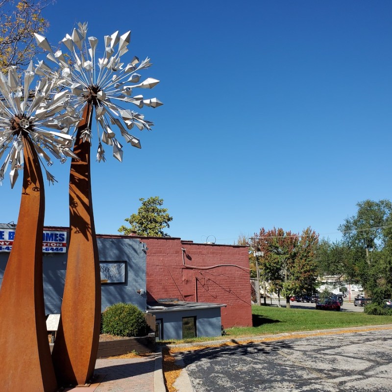 The Dandeblome sculpture on Main Street in Blue Springs.