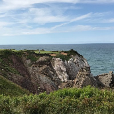 The world renowned pat 3, 16th hole at Cabot Cliffs.
