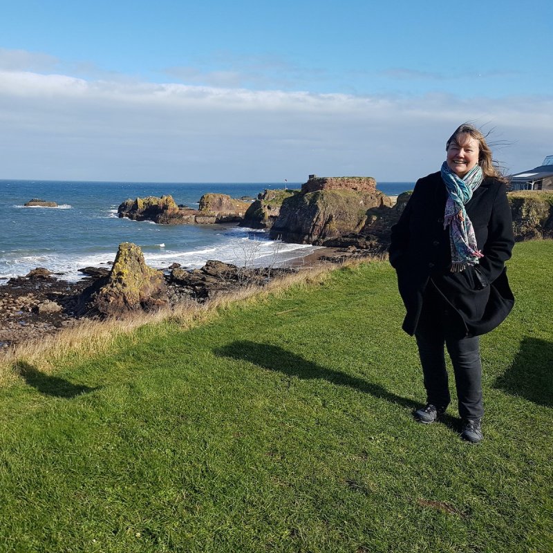 The writer near castle ruins.