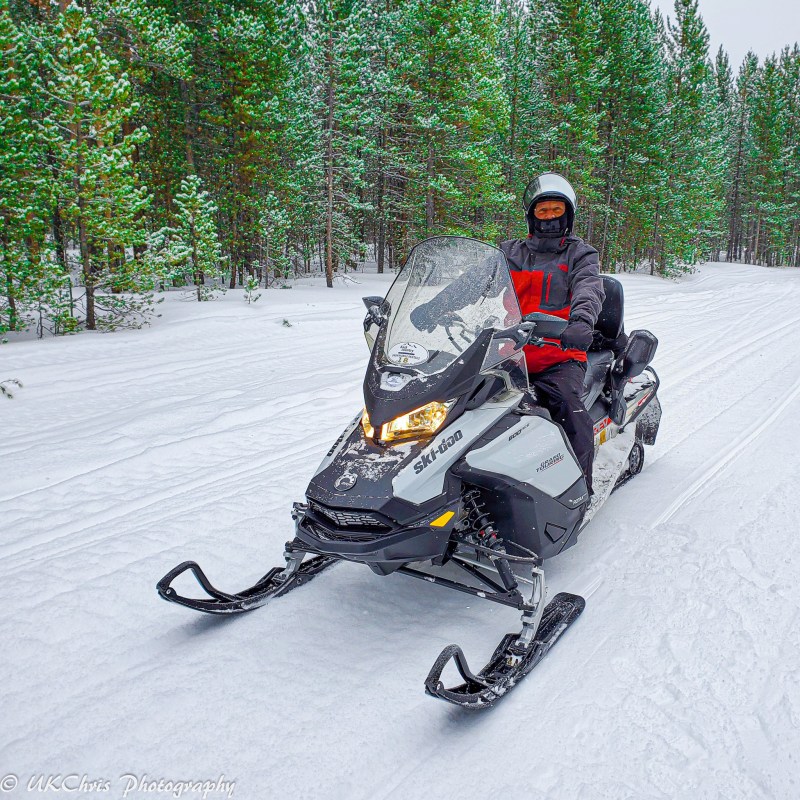 The writer snowmobiling for the first time at the age of sixty.