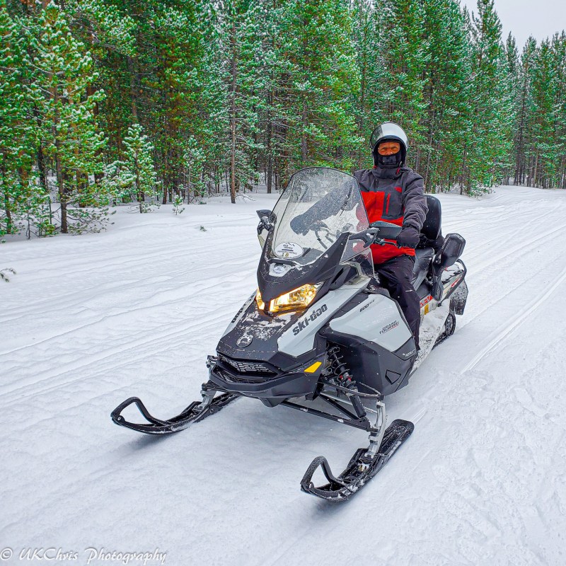 The writer snowmobiling for the first time at the age of sixty.