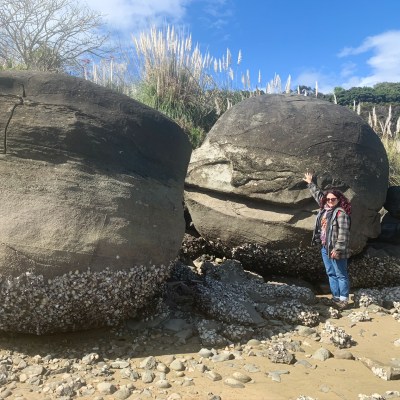 The writer with the Koutu Boulders in New Zealand's Northland.