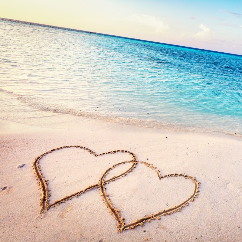 Two hearts in the sand on a beach in the Maldives.