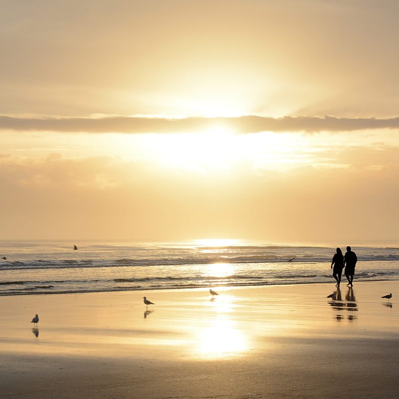 Retirees walking on beautiful Daytona Beach