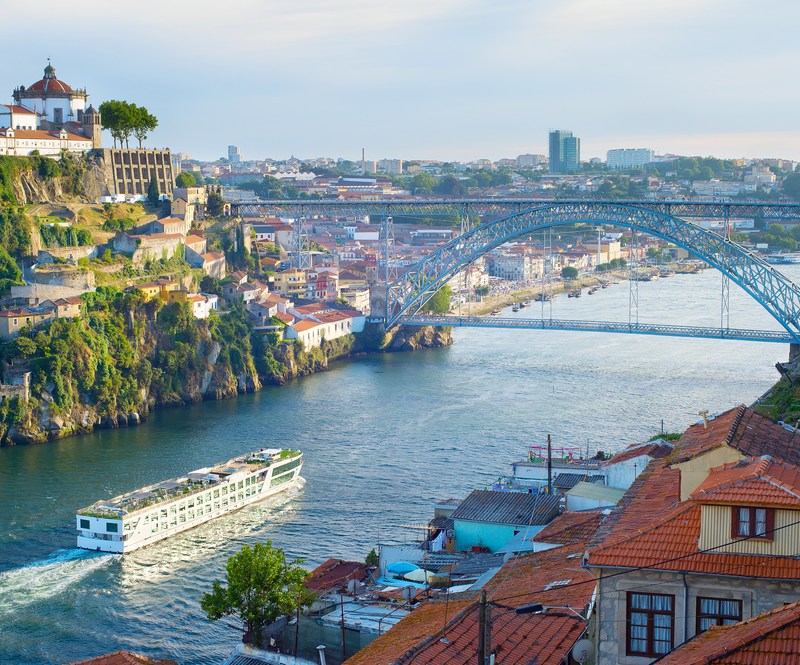 Cruise ship arrives to Porto by the river Douro. Portugal