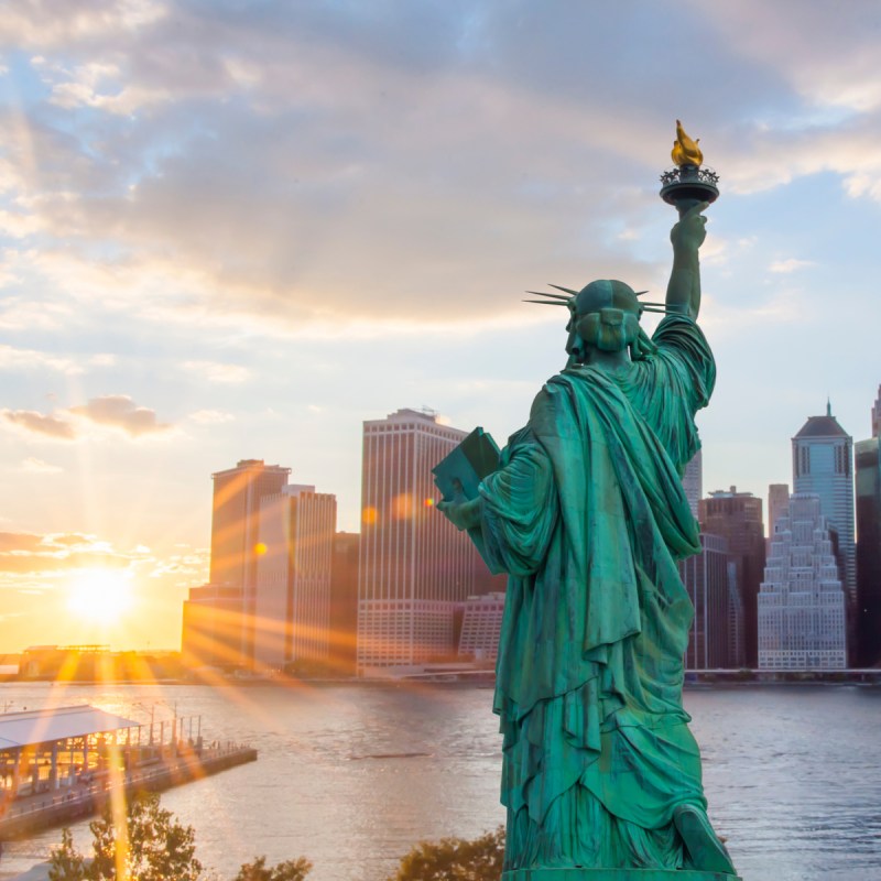 Statue of Liberty viewing sun.