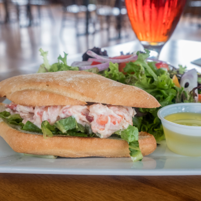 Lobster Roll Served with Fresh Green Salad and Glass of Beer