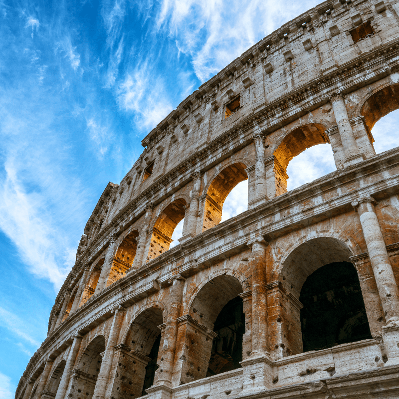 Close up view of Rome Colosseum in Rome , Italy . The Colosseum was built in the time of Ancient Rome in the city center. It is one of Rome most popular tourist attractions in Italy .