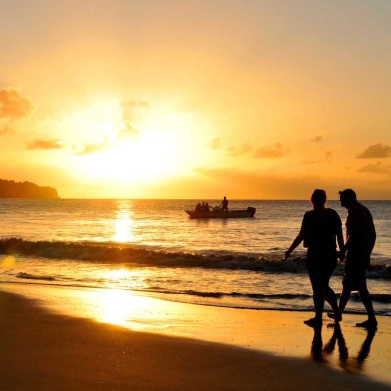 Couple walking on St. Lucia beach.