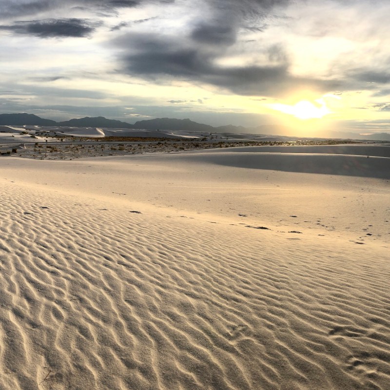 Sunset over White Sands National Park dunes in New Mexico.