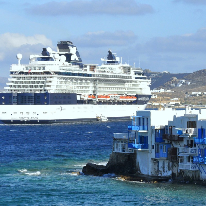 Celebrity Cruise ship by the harbour in Mykonos, Greece on the island.