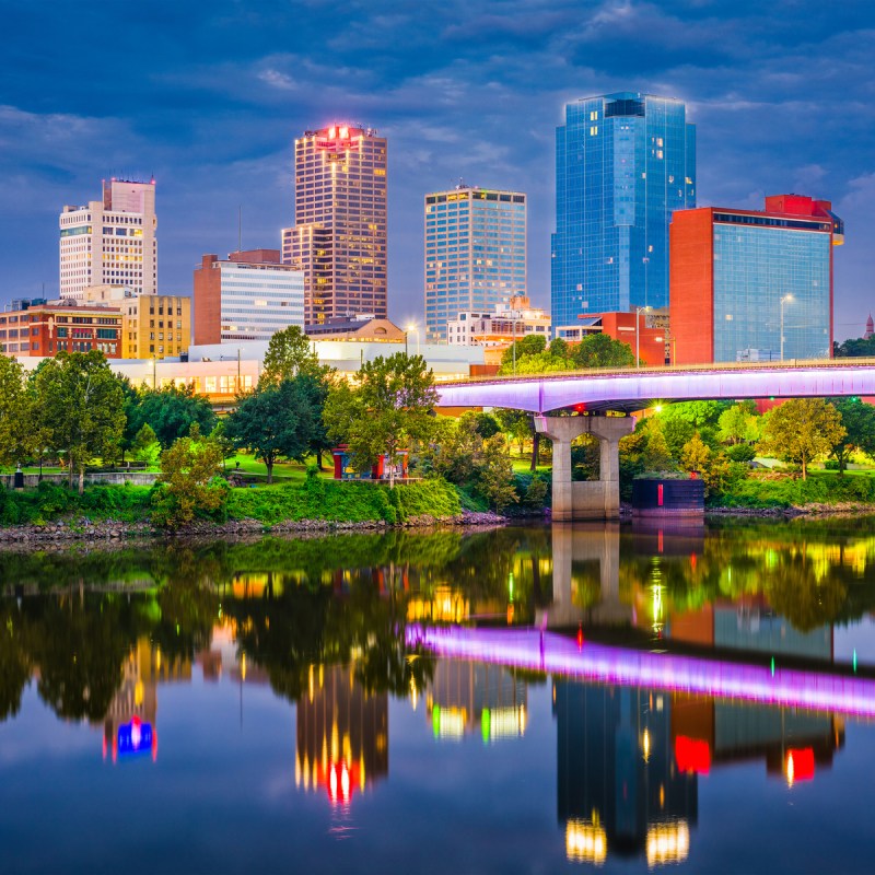 Little Rock, Arkansas, skyline on the river at twilight.