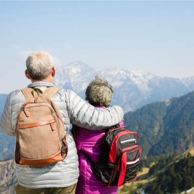 Rear view of senior couple watching the mountains
