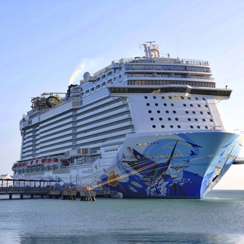 A Norwegian Cruise Line ship in Harvest Caye, Belize.