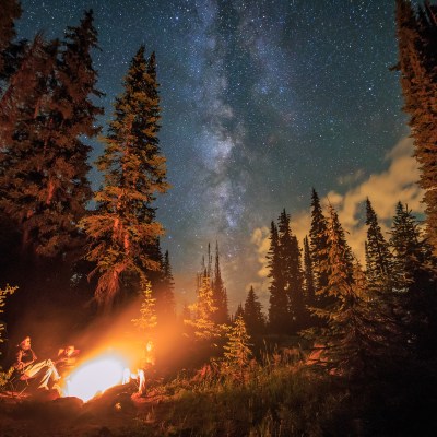 Family camping at night near Rocky Mountain National Park