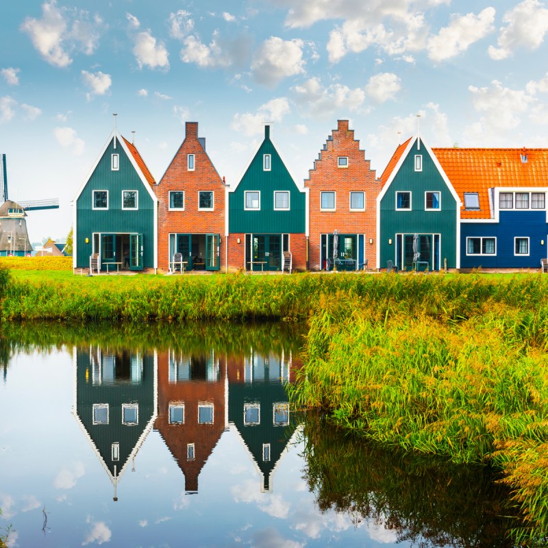 Town houses set along a body of water in the town of Volendam in North Holland, Netherlands.