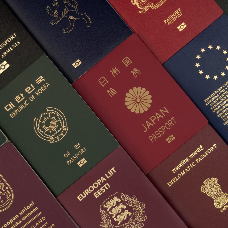 Different foreign passports from many countries by the world as colorful background