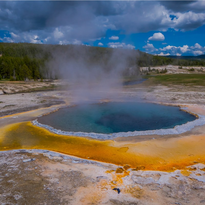 Crested pool hot spring and orange microbial mat in the old faithful geyser basin of Yellowstone National Park, Wyoming