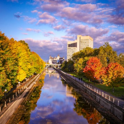 Ottawa's reflection off the Rideau Canal, Canada.